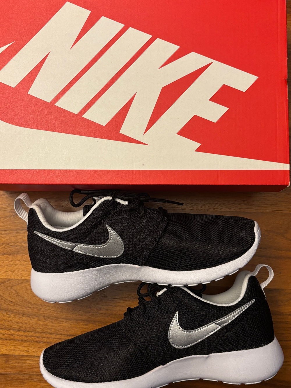 Nike Black Sneakers with Silver Swoosh